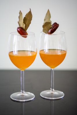 Two glasses of orange colored wine.